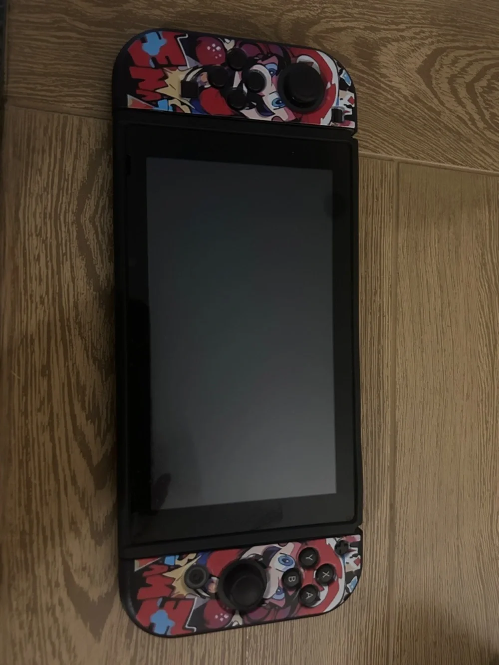 Nintendo Switch with Red, Blue, Black Graphic Controller Wraps